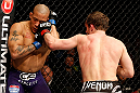 STOCKHOLM, SWEDEN - APRIL 06:  (R-L) Brad Pickett punches Mike Easton in their bantamweight fight at the Ericsson Globe Arena on April 6, 2013 in Stockholm, Sweden.  (Photo by Josh Hedges/Zuffa LLC/Zuffa LLC via Getty Images)