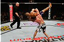 STOCKHOLM, SWEDEN - APRIL 06:  (R-L) Brad Pickett takes down Mike Easton in their bantamweight fight at the Ericsson Globe Arena on April 6, 2013 in Stockholm, Sweden.  (Photo by Josh Hedges/Zuffa LLC/Zuffa LLC via Getty Images)