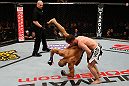 STOCKHOLM, SWEDEN - APRIL 06:  (R-L) Brad Pickett takes down Mike Easton in their bantamweight fight at the Ericsson Globe Arena on April 6, 2013 in Stockholm, Sweden.  (Photo by Josh Hedges/Zuffa LLC/Zuffa LLC via Getty Images)