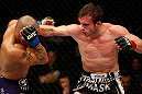 STOCKHOLM, SWEDEN - APRIL 06:  (R-L) Brad Pickett punches Mike Easton in their bantamweight fight at the Ericsson Globe Arena on April 6, 2013 in Stockholm, Sweden.  (Photo by Josh Hedges/Zuffa LLC/Zuffa LLC via Getty Images)