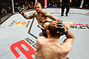 STOCKHOLM, SWEDEN - APRIL 06:  (L-R) Ross Pearson kicks Ryan Couture in their lightweight fight at the Ericsson Globe Arena on April 6, 2013 in Stockholm, Sweden.  (Photo by Josh Hedges/Zuffa LLC/Zuffa LLC via Getty Images)