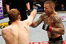 STOCKHOLM, SWEDEN - APRIL 06:  (L-R) Ryan Couture punches Ross Pearson in their lightweight fight at the Ericsson Globe Arena on April 6, 2013 in Stockholm, Sweden.  (Photo by Josh Hedges/Zuffa LLC/Zuffa LLC via Getty Images)