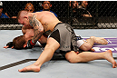 STOCKHOLM, SWEDEN - APRIL 06:  (R-L) Ross Pearson punches Ryan Couture in their lightweight fight at the Ericsson Globe Arena on April 6, 2013 in Stockholm, Sweden.  (Photo by Josh Hedges/Zuffa LLC/Zuffa LLC via Getty Images)