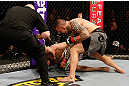 STOCKHOLM, SWEDEN - APRIL 06:  (R-L) Ross Pearson punches Ryan Couture in their lightweight fight at the Ericsson Globe Arena on April 6, 2013 in Stockholm, Sweden.  (Photo by Josh Hedges/Zuffa LLC/Zuffa LLC via Getty Images)