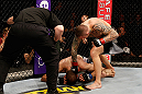 STOCKHOLM, SWEDEN - APRIL 06:  (R-L) Ross Pearson punches Ryan Couture in their lightweight fight at the Ericsson Globe Arena on April 6, 2013 in Stockholm, Sweden.  (Photo by Josh Hedges/Zuffa LLC/Zuffa LLC via Getty Images)