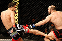 STOCKHOLM, SWEDEN - APRIL 06:  (L-R) Gegard Mousasi kicks Ilir Latifi in their light heavyweight fight at the Ericsson Globe Arena on April 6, 2013 in Stockholm, Sweden.  (Photo by Josh Hedges/Zuffa LLC/Zuffa LLC via Getty Images)