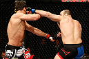STOCKHOLM, SWEDEN - APRIL 06:  (R-L) Ilir Latifi punches Gegard Mousasi in their light heavyweight fight at the Ericsson Globe Arena on April 6, 2013 in Stockholm, Sweden.  (Photo by Josh Hedges/Zuffa LLC/Zuffa LLC via Getty Images)