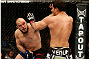 STOCKHOLM, SWEDEN - APRIL 06:  (L-R) Ilir Latifi punches Gegard Mousasi in their light heavyweight fight at the Ericsson Globe Arena on April 6, 2013 in Stockholm, Sweden.  (Photo by Josh Hedges/Zuffa LLC/Zuffa LLC via Getty Images)