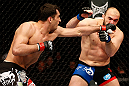 STOCKHOLM, SWEDEN - APRIL 06:  (L-R) Gegard Mousasi punches Ilir Latifi in their light heavyweight fight at the Ericsson Globe Arena on April 6, 2013 in Stockholm, Sweden.  (Photo by Josh Hedges/Zuffa LLC/Zuffa LLC via Getty Images)
