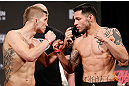 LAS VEGAS, NV - APRIL 12: (L-R) Opponents Justin Lawrence and Daniel Pineda face off during the TUF 17 Finale weigh-in at the Hollywood Theatre at the MGM Grand Hotel/Casino on April 12, 2013 in Las Vegas, Nevada. (Photo by Josh Hedges/Zuffa LLC/Zuffa LLC via Getty Images)