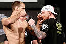 LAS VEGAS, NV - APRIL 12: (L-R) Opponents Cole Miller and Bart Palaszewski face off during the TUF 17 Finale weigh-in at the Hollywood Theatre at the MGM Grand Hotel/Casino on April 12, 2013 in Las Vegas, Nevada. (Photo by Josh Hedges/Zuffa LLC/Zuffa LLC via Getty Images)