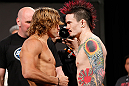LAS VEGAS, NV - APRIL 12: (L-R) Opponents Urijah Faber and Scott Jorgensen face off during the TUF 17 Finale weigh-in at the Hollywood Theatre at the MGM Grand Hotel/Casino on April 12, 2013 in Las Vegas, Nevada. (Photo by Josh Hedges/Zuffa LLC/Zuffa LLC via Getty Images)