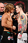 LAS VEGAS, NV - APRIL 12: (L-R) Opponents Urijah Faber and Scott Jorgensen face off during the TUF 17 Finale weigh-in at the Hollywood Theatre at the MGM Grand Hotel/Casino on April 12, 2013 in Las Vegas, Nevada. (Photo by Josh Hedges/Zuffa LLC/Zuffa LLC via Getty Images)