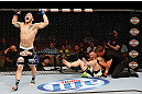 LAS VEGAS, NV - APRIL 13:   Daniel Pineda (left) reacts to his submission victory over Justin Lawrence (right) in their featherweight fight at the Mandalay Bay Events Center  on April 13, 2013 in Las Vegas, Nevada.  (Photo by Josh Hedges/Zuffa LLC/Zuffa LLC via Getty Images)  *** Local Caption *** Justin Lawrence; Daniel Pineda