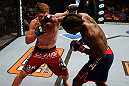 LAS VEGAS, NV - APRIL 13:   (R-L) Clint Hester punches Bristol Marunde in their middleweight fight at the Mandalay Bay Events Center  on April 13, 2013 in Las Vegas, Nevada.  (Photo by Josh Hedges/Zuffa LLC/Zuffa LLC via Getty Images)  *** Local Caption *** Clint Hester; Bristol Marunde