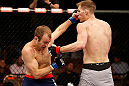 LAS VEGAS, NV - APRIL 13:   (L-R) Collin Hart punches Luke Barnatt in their middleweight fight at the Mandalay Bay Events Center  on April 13, 2013 in Las Vegas, Nevada.  (Photo by Josh Hedges/Zuffa LLC/Zuffa LLC via Getty Images)  *** Local Caption *** Luke Barnatt; Collin Hart
