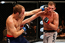 LAS VEGAS, NV - APRIL 13:   (L-R) Collin Hart punches Luke Barnatt in their middleweight fight at the Mandalay Bay Events Center  on April 13, 2013 in Las Vegas, Nevada.  (Photo by Josh Hedges/Zuffa LLC/Zuffa LLC via Getty Images)  *** Local Caption *** Luke Barnatt; Collin Hart