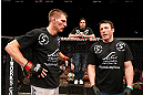 LAS VEGAS, NV - APRIL 13:   (L-R) Collin Hart speaks with Chael Sonnen after his middleweight fight at the Mandalay Bay Events Center  on April 13, 2013 in Las Vegas, Nevada.  (Photo by Josh Hedges/Zuffa LLC/Zuffa LLC via Getty Images)  *** Local Caption *** Luke Barnatt; Collin Hart