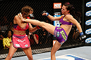 LAS VEGAS, NV - APRIL 13:   (R-L) Cat Zingano kicks Miesha Tate in their bantamweight fight at the Mandalay Bay Events Center  on April 13, 2013 in Las Vegas, Nevada.  (Photo by Josh Hedges/Zuffa LLC/Zuffa LLC via Getty Images)  *** Local Caption *** Miesha Tate; Cat Zingano
