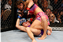 LAS VEGAS, NV - APRIL 13:   Miesha Tate (top) punches Cat Zingano in their bantamweight fight at the Mandalay Bay Events Center  on April 13, 2013 in Las Vegas, Nevada.  (Photo by Josh Hedges/Zuffa LLC/Zuffa LLC via Getty Images)  *** Local Caption *** Miesha Tate; Cat Zingano
