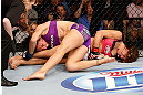 LAS VEGAS, NV - APRIL 13:   Miesha Tate (right) attempts to submit Cat Zingano in their bantamweight fight at the Mandalay Bay Events Center  on April 13, 2013 in Las Vegas, Nevada.  (Photo by Josh Hedges/Zuffa LLC/Zuffa LLC via Getty Images)  *** Local Caption *** Miesha Tate; Cat Zingano