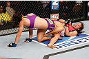 LAS VEGAS, NV - APRIL 13:   Miesha Tate (right) attempts to submit Cat Zingano in their bantamweight fight at the Mandalay Bay Events Center  on April 13, 2013 in Las Vegas, Nevada.  (Photo by Josh Hedges/Zuffa LLC/Zuffa LLC via Getty Images)  *** Local Caption *** Miesha Tate; Cat Zingano