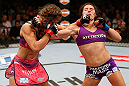 LAS VEGAS, NV - APRIL 13:   (L-R) Miesha Tate and Cat Zingano exchange punches in their bantamweight fight at the Mandalay Bay Events Center  on April 13, 2013 in Las Vegas, Nevada.  (Photo by Josh Hedges/Zuffa LLC/Zuffa LLC via Getty Images)  *** Local Caption *** Miesha Tate; Cat Zingano