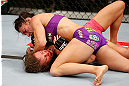LAS VEGAS, NV - APRIL 13:   Cat Zingano (top) elbows Miesha Tate in their bantamweight fight at the Mandalay Bay Events Center  on April 13, 2013 in Las Vegas, Nevada.  (Photo by Josh Hedges/Zuffa LLC/Zuffa LLC via Getty Images)  *** Local Caption *** Miesha Tate; Cat Zingano