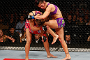 LAS VEGAS, NV - APRIL 13:   Cat Zingano (right) knees Miesha Tate in their bantamweight fight at the Mandalay Bay Events Center  on April 13, 2013 in Las Vegas, Nevada.  (Photo by Josh Hedges/Zuffa LLC/Zuffa LLC via Getty Images)  *** Local Caption *** Miesha Tate; Cat Zingano