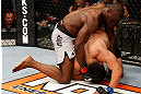 LAS VEGAS, NV - APRIL 13:   Uriah Hall (top) punches Kelvin Gastelum in their middleweight fight at the Mandalay Bay Events Center  on April 13, 2013 in Las Vegas, Nevada.  (Photo by Josh Hedges/Zuffa LLC/Zuffa LLC via Getty Images)  *** Local Caption *** Uriah Hall; Kelvin Gastelum