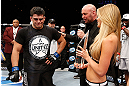 LAS VEGAS, NV - APRIL 13:   Kelvin Gastelum (left) is presented the Ultimate Fighter season 17 trophy by UFC President Dana White (right) in their middleweight fight at the Mandalay Bay Events Center  on April 13, 2013 in Las Vegas, Nevada.  (Photo by Josh Hedges/Zuffa LLC/Zuffa LLC via Getty Images)  *** Local Caption *** Uriah Hall; Kelvin Gastelum