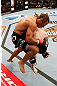 LAS VEGAS, NV - APRIL 13:   Urijah Faber (top) knees Scott Jorgensen in their bantamweight fight at the Mandalay Bay Events Center  on April 13, 2013 in Las Vegas, Nevada.  (Photo by Josh Hedges/Zuffa LLC/Zuffa LLC via Getty Images)  *** Local Caption *** Urijah Faber; Scott Jorgensen