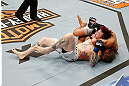 LAS VEGAS, NV - APRIL 13:   Urijah Faber (right) attempts to submit Scott Jorgensen in their bantamweight fight at the Mandalay Bay Events Center  on April 13, 2013 in Las Vegas, Nevada.  (Photo by Josh Hedges/Zuffa LLC/Zuffa LLC via Getty Images)  *** Local Caption *** Urijah Faber; Scott Jorgensen