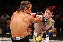 LAS VEGAS, NV - APRIL 13:   (R-L) Scott Jorgensen punches Urijah Faber in their bantamweight fight at the Mandalay Bay Events Center  on April 13, 2013 in Las Vegas, Nevada.  (Photo by Josh Hedges/Zuffa LLC/Zuffa LLC via Getty Images)  *** Local Caption *** Urijah Faber; Scott Jorgensen