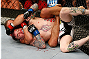 LAS VEGAS, NV - APRIL 13:   Urijah Faber (top) attempts to submit Scott Jorgensen in their bantamweight fight at the Mandalay Bay Events Center  on April 13, 2013 in Las Vegas, Nevada.  (Photo by Josh Hedges/Zuffa LLC/Zuffa LLC via Getty Images)  *** Local Caption *** Urijah Faber; Scott Jorgensen