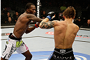 SAN JOSE, CA - APRIL 20:   (L-R) Anthony Njokuani punches Roger Bowling in their lightweight bout during the UFC on FOX event at the HP Pavilion on April 20, 2013 in San Jose, California.  (Photo by Ezra Shaw/Zuffa LLC/Zuffa LLC via Getty Images)  *** Local Caption *** Anthony Njokuani; Roger Bowling