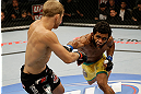 SAN JOSE, CA - APRIL 20:   (R-L) Hugo Viana punches T.J. Dillashaw in their bantamweight bout during the UFC on FOX event at the HP Pavilion on April 20, 2013 in San Jose, California.  (Photo by Ezra Shaw/Zuffa LLC/Zuffa LLC via Getty Images)  *** Local Caption *** T.J. Dillashaw; Hugo Viana