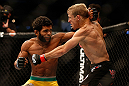 SAN JOSE, CA - APRIL 20:   (L-R) Hugo Viana punches T.J. Dillashaw in their bantamweight bout during the UFC on FOX event during the UFC on FOX event at the HP Pavilion on April 20, 2013 in San Jose, California.  (Photo by Josh Hedges/Zuffa LLC/Zuffa LLC via Getty Images)  *** Local Caption *** T.J. Dillashaw; Hugo Viana
