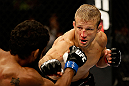 SAN JOSE, CA - APRIL 20:   (R-L) T.J. Dillashaw punches Hugo Viana in their bantamweight bout during the UFC on FOX event at the HP Pavilion on April 20, 2013 in San Jose, California.  (Photo by Ezra Shaw/Zuffa LLC/Zuffa LLC via Getty Images)  *** Local Caption *** T.J. Dillashaw; Hugo Viana
