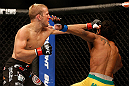 SAN JOSE, CA - APRIL 20:   (L-R) T.J. Dillashaw punches Hugo Viana in their bantamweight bout during the UFC on FOX event during the UFC on FOX event at the HP Pavilion on April 20, 2013 in San Jose, California.  (Photo by Josh Hedges/Zuffa LLC/Zuffa LLC via Getty Images)  *** Local Caption *** T.J. Dillashaw; Hugo Viana