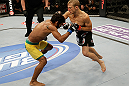 SAN JOSE, CA - APRIL 20:   (R-L) T.J. Dillashaw punches Hugo Viana in their bantamweight bout during the UFC on FOX event at the HP Pavilion on April 20, 2013 in San Jose, California.  (Photo by Ezra Shaw/Zuffa LLC/Zuffa LLC via Getty Images)  *** Local Caption *** T.J. Dillashaw; Hugo Viana
