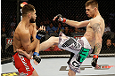 SAN JOSE, CA - APRIL 20:   (R-L) Tim Means kicks Jorge Masvidal in their lightweight bout during the UFC on FOX event at the HP Pavilion on April 20, 2013 in San Jose, California.  (Photo by Ezra Shaw/Zuffa LLC/Zuffa LLC via Getty Images)  *** Local Caption *** Tim Means; Jorge Masvidal