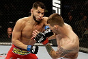 SAN JOSE, CA - APRIL 20:   (L-R) Jorge Masvidal punches Tim Means in their lightweight bout during the UFC on FOX event at the HP Pavilion on April 20, 2013 in San Jose, California.  (Photo by Ezra Shaw/Zuffa LLC/Zuffa LLC via Getty Images)  *** Local Caption *** Tim Means; Jorge Masvidal