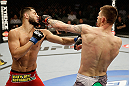 SAN JOSE, CA - APRIL 20:   (R-L) Tim Means punches Jorge Masvidal in their lightweight bout during the UFC on FOX event at the HP Pavilion on April 20, 2013 in San Jose, California.  (Photo by Ezra Shaw/Zuffa LLC/Zuffa LLC via Getty Images)  *** Local Caption *** Tim Means; Jorge Masvidal