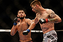 SAN JOSE, CA - APRIL 20:   (R-L) Tim Means punches Jorge Masvidal in their lightweight bout during the UFC on FOX event during the UFC on FOX event at the HP Pavilion on April 20, 2013 in San Jose, California.  (Photo by Josh Hedges/Zuffa LLC/Zuffa LLC via Getty Images)  *** Local Caption *** Tim Means; Jorge Masvidal