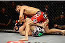 SAN JOSE, CA - APRIL 20:   Jorge Masvidal (top) punches Tim Means in their lightweight bout during the UFC on FOX event at the HP Pavilion on April 20, 2013 in San Jose, California.  (Photo by Ezra Shaw/Zuffa LLC/Zuffa LLC via Getty Images)  *** Local Caption *** Tim Means; Jorge Masvidal