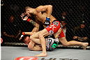 SAN JOSE, CA - APRIL 20:   Jorge Masvidal (top) punches Tim Means in their lightweight bout during the UFC on FOX event at the HP Pavilion on April 20, 2013 in San Jose, California.  (Photo by Ezra Shaw/Zuffa LLC/Zuffa LLC via Getty Images)  *** Local Caption *** Tim Means; Jorge Masvidal