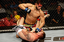 SAN JOSE, CA - APRIL 20:   Jorge Masvidal (top) punches Tim Means in their lightweight bout during the UFC on FOX event at the HP Pavilion on April 20, 2013 in San Jose, California.  (Photo by Ezra Shaw/Zuffa LLC/Zuffa LLC via Getty Images)  *** Local Caption *** Tim Means; Jorge Masvidal