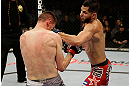 SAN JOSE, CA - APRIL 20:   (R-L) Jorge Masvidal punches Tim Means in their lightweight bout during the UFC on FOX event at the HP Pavilion on April 20, 2013 in San Jose, California.  (Photo by Ezra Shaw/Zuffa LLC/Zuffa LLC via Getty Images)  *** Local Caption *** Tim Means; Jorge Masvidal
