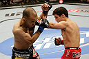 SAN JOSE, CA - APRIL 20:   (R-L) Joseph Benavidez punches Darren Uyenoyama in their flyweight bout during the UFC on FOX event at the HP Pavilion on April 20, 2013 in San Jose, California.  (Photo by Ezra Shaw/Zuffa LLC/Zuffa LLC via Getty Images)  *** Local Caption *** Joseph Benavidez; Darren Uyenoyama